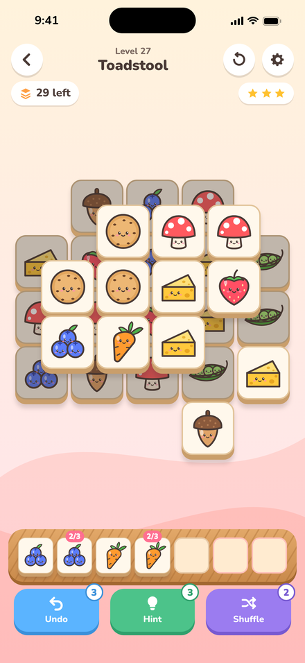 Nibble Stack gameplay: matching snack tiles in a stacked level